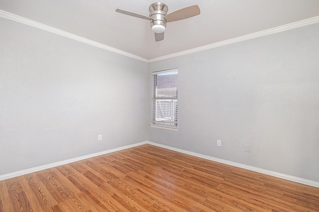 spare room with ceiling fan, crown molding, and hardwood / wood-style flooring