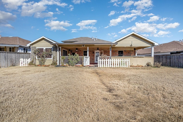 view of front of home featuring a front yard and covered porch