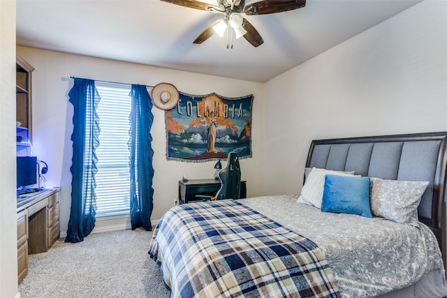 bedroom featuring ceiling fan and light carpet