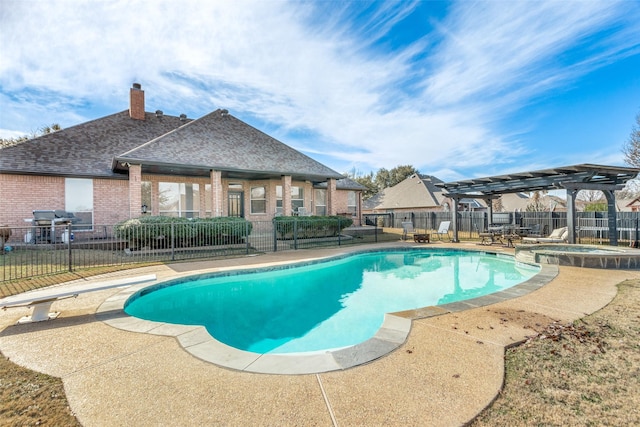 view of swimming pool with an in ground hot tub, a patio area, a diving board, and a pergola