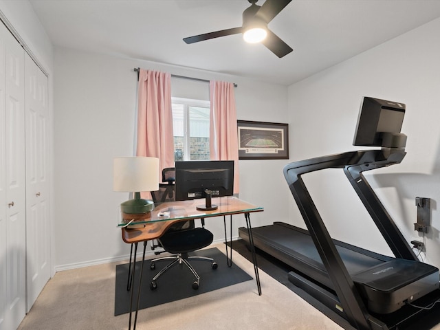 home office with light carpet and ceiling fan