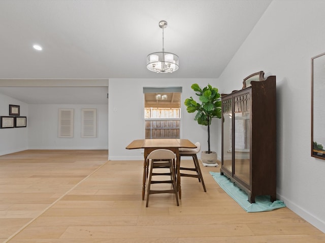 dining room featuring a chandelier and light hardwood / wood-style floors