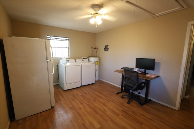 laundry room featuring light hardwood / wood-style floors, ceiling fan, washer and clothes dryer, and water heater