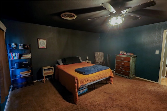 bedroom featuring ceiling fan and dark colored carpet