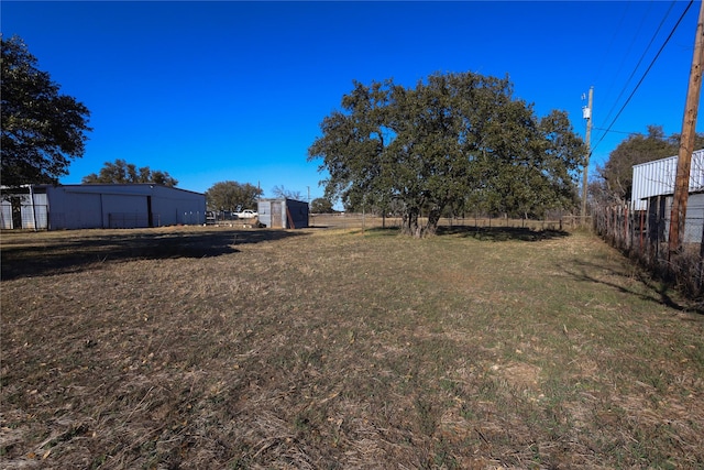 view of yard with a storage unit