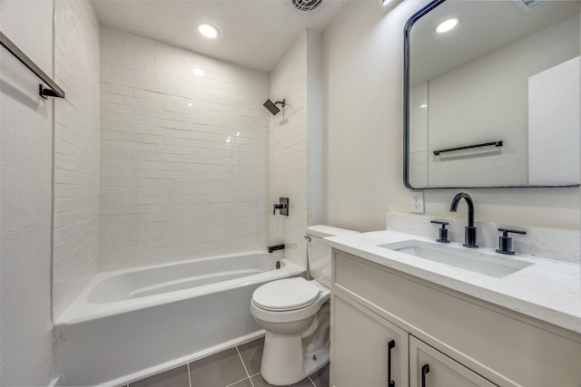 full bathroom with tiled shower / bath combo, vanity, tile patterned flooring, and toilet