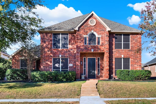 view of front facade with a front yard