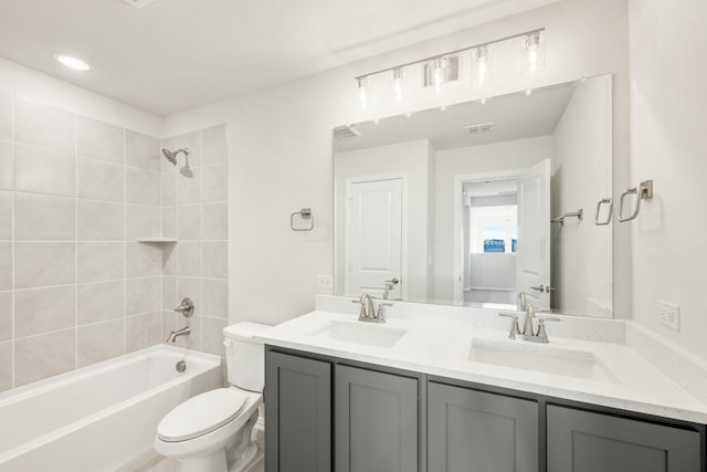 175 Creekside Dr, Sanger, TX 76266 - full bath with double vanity, visible vents, toilet, and a sink