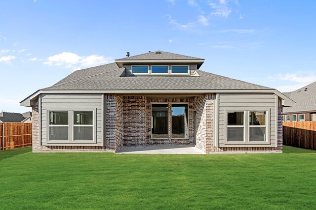 175 Creekside Dr, Sanger, TX 76266 - back of house with a fenced backyard, a lawn, brick siding, and roof with shingles