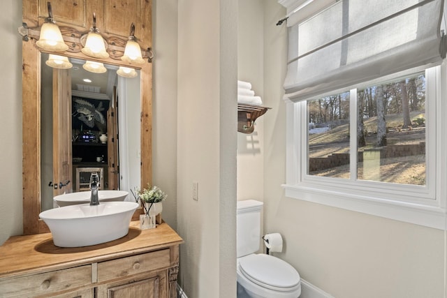 bathroom with toilet and vanity