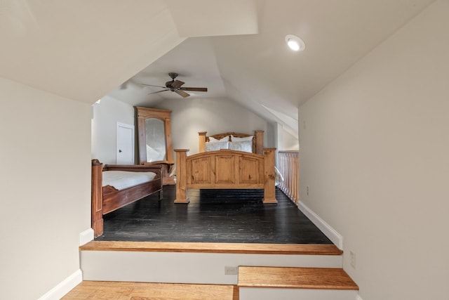 bedroom with lofted ceiling, ceiling fan, and hardwood / wood-style flooring