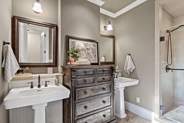 bathroom with crown molding, double sink, and a shower with door