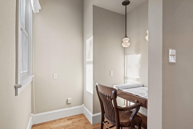 office with hardwood / wood-style flooring