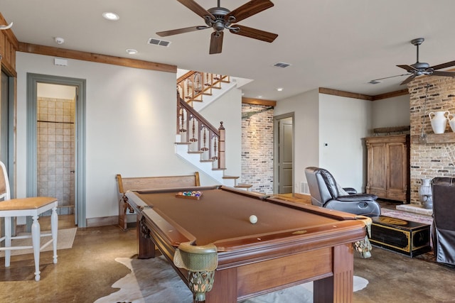 rec room with ceiling fan, concrete flooring, brick wall, and billiards