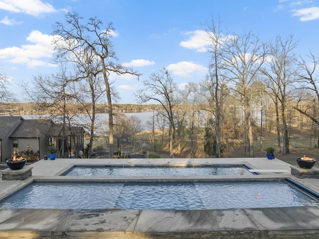 view of pool featuring a patio