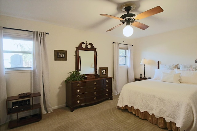 bedroom with light carpet and ceiling fan