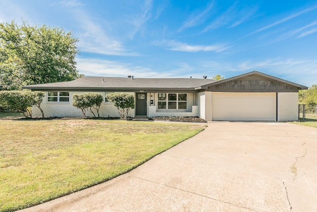 ranch-style home with a garage and a front lawn