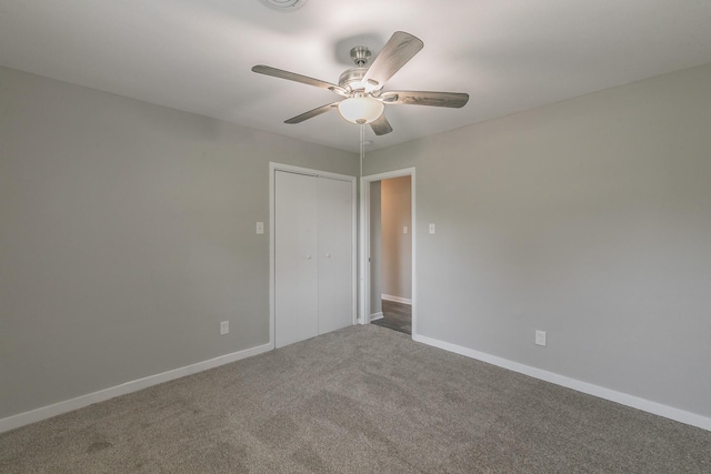 unfurnished room with ceiling fan and carpet flooring