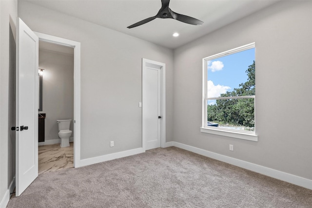 unfurnished bedroom featuring carpet, recessed lighting, ceiling fan, connected bathroom, and baseboards