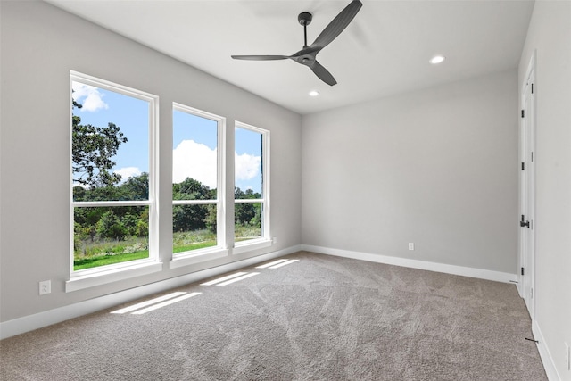 empty room with carpet floors and ceiling fan