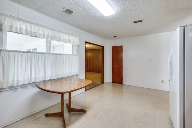 interior space featuring a textured ceiling