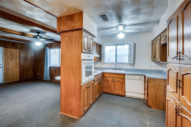 kitchen with ceiling fan, sink, tasteful backsplash, and white appliances