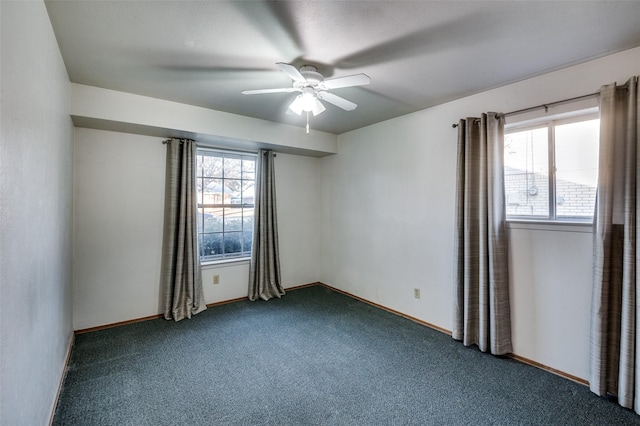 carpeted spare room with ceiling fan