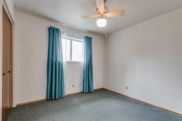 carpeted empty room with ceiling fan