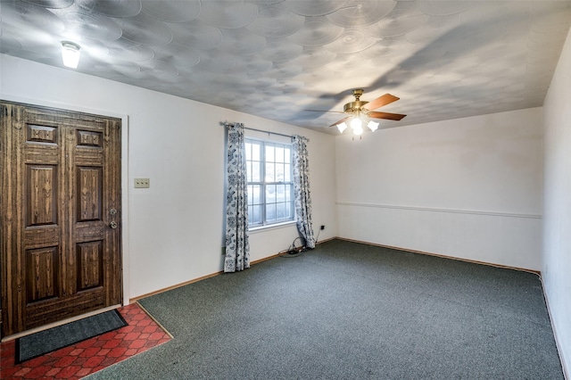 foyer featuring carpet floors and ceiling fan