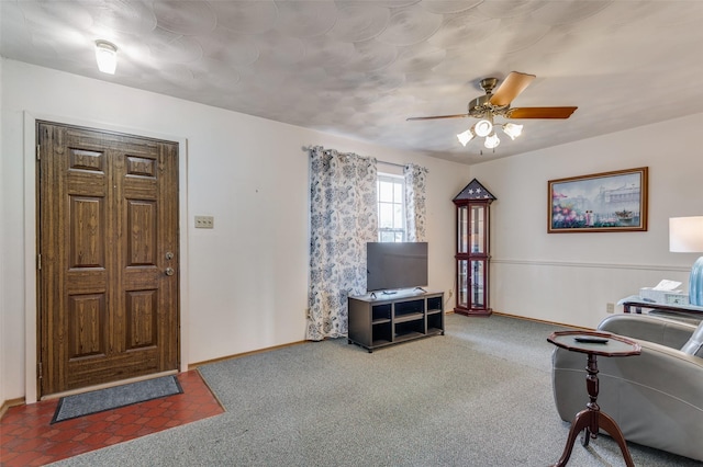 carpeted living room with ceiling fan