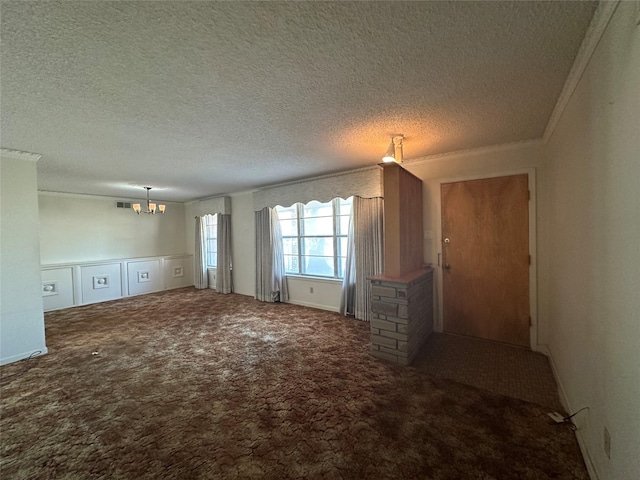 unfurnished living room with carpet, crown molding, a notable chandelier, and a textured ceiling