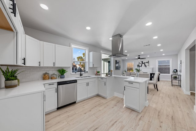 kitchen featuring kitchen peninsula, ceiling fan, dishwasher, white cabinets, and sink