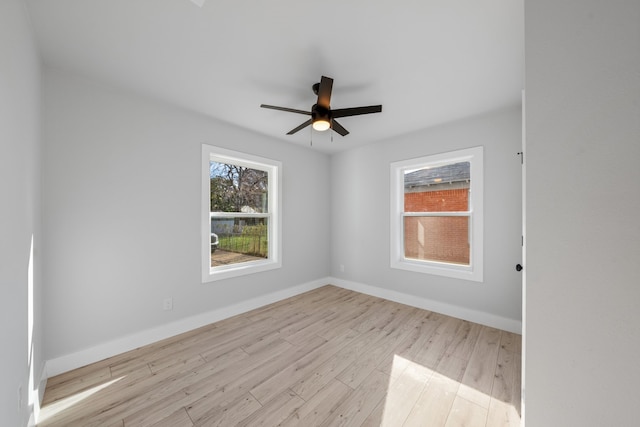 unfurnished room with ceiling fan and light hardwood / wood-style flooring