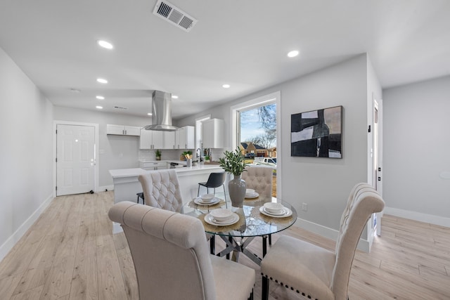 dining room featuring light wood-type flooring