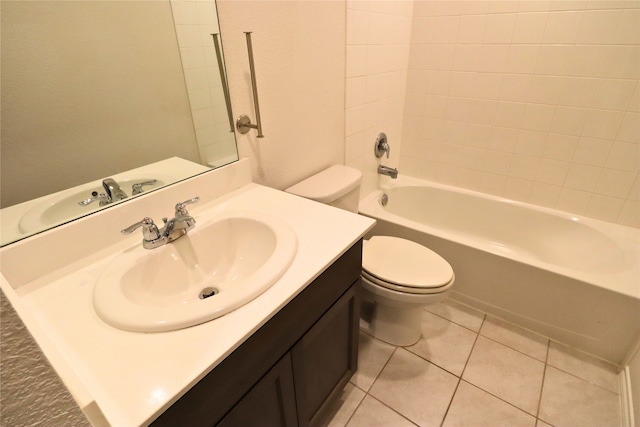 full bathroom with a textured wall, toilet, tile patterned floors, tub / shower combination, and vanity