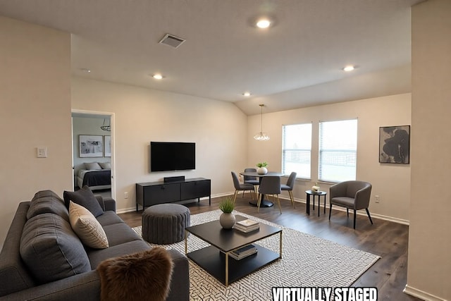 living room with lofted ceiling, dark wood-style floors, baseboards, and visible vents