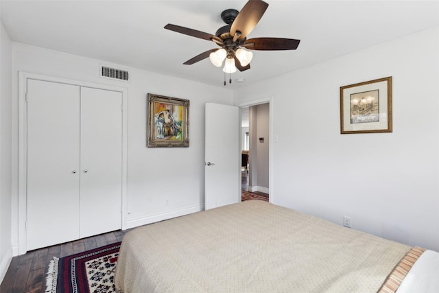 bedroom featuring a closet, ceiling fan, and dark wood-type flooring