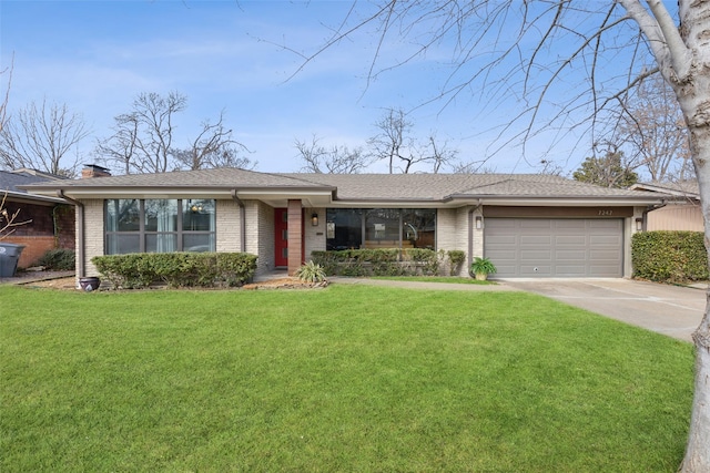 single story home featuring a garage and a front lawn