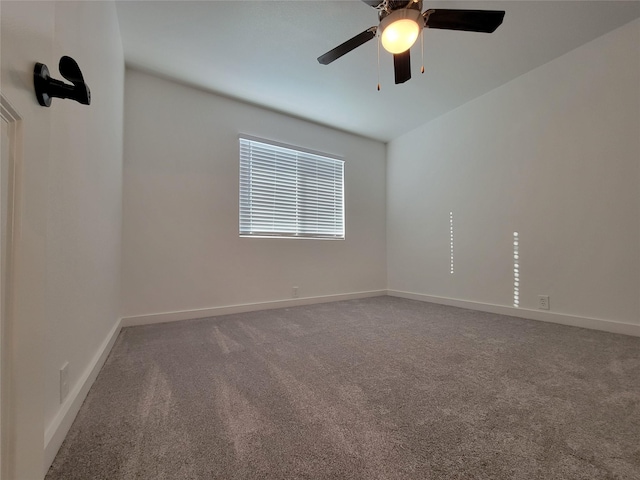 unfurnished room featuring ceiling fan and carpet flooring