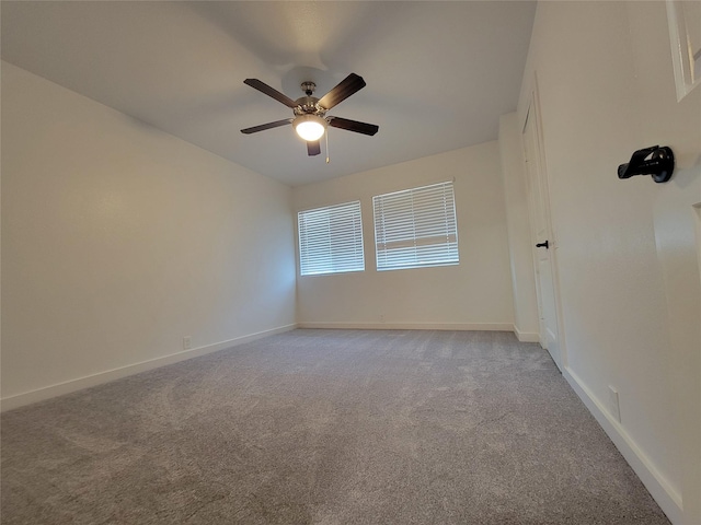 unfurnished room with ceiling fan and light colored carpet