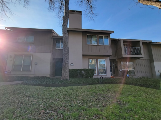 rear view of house with a lawn