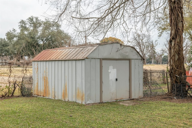 view of outdoor structure with a lawn