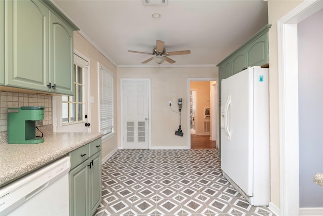 kitchen featuring white appliances, tasteful backsplash, green cabinetry, ceiling fan, and crown molding