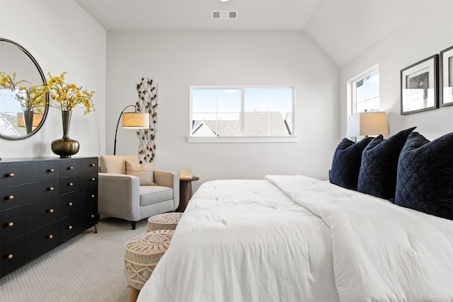 carpeted bedroom featuring lofted ceiling