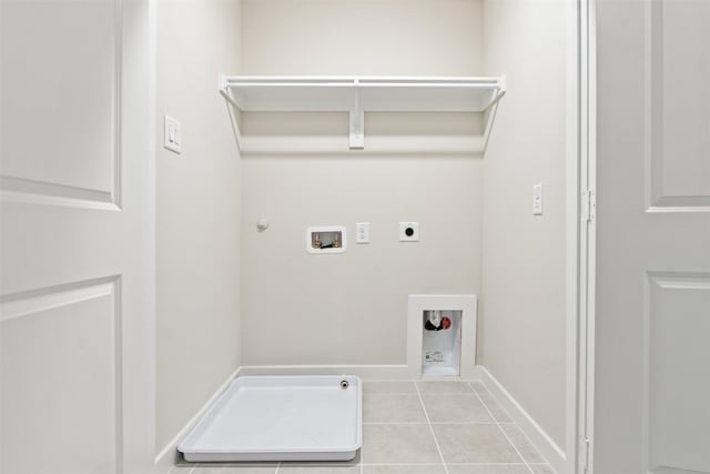 laundry room with hookup for a washing machine, hookup for a gas dryer, hookup for an electric dryer, and light tile patterned floors