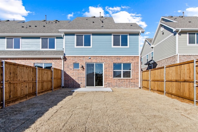 back of house with a patio