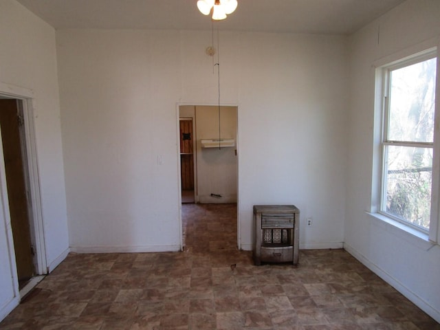 spare room featuring heating unit