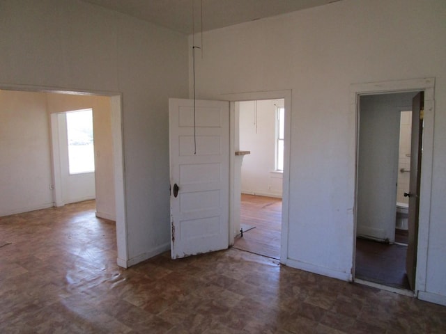 spare room featuring a high ceiling