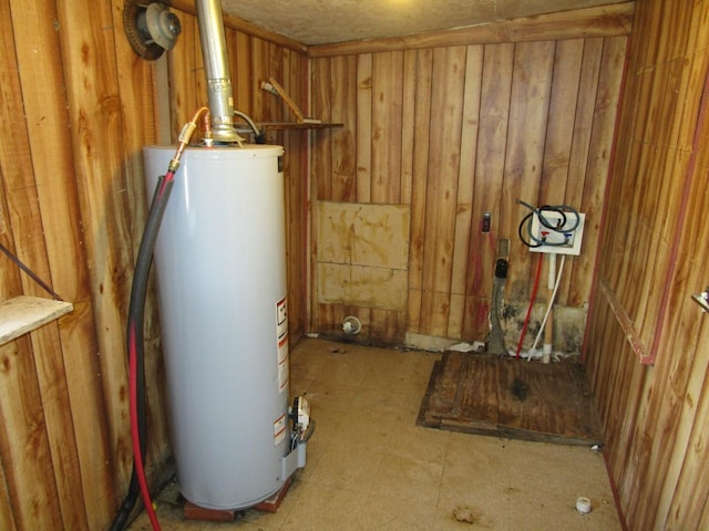 utility room featuring gas water heater