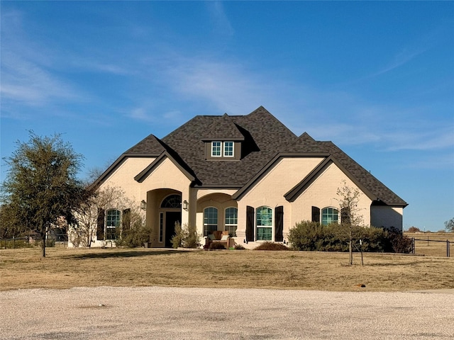 french country home with a front yard